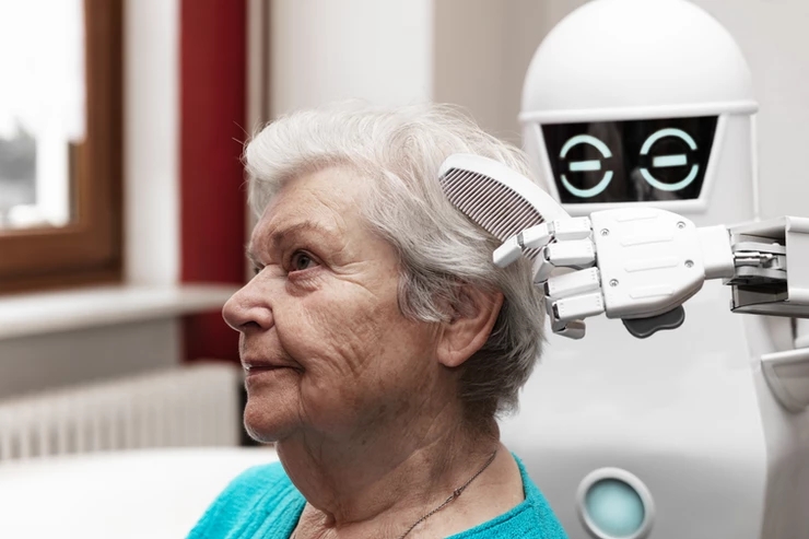 The robot care giver assisting an old woman with her hairs. 